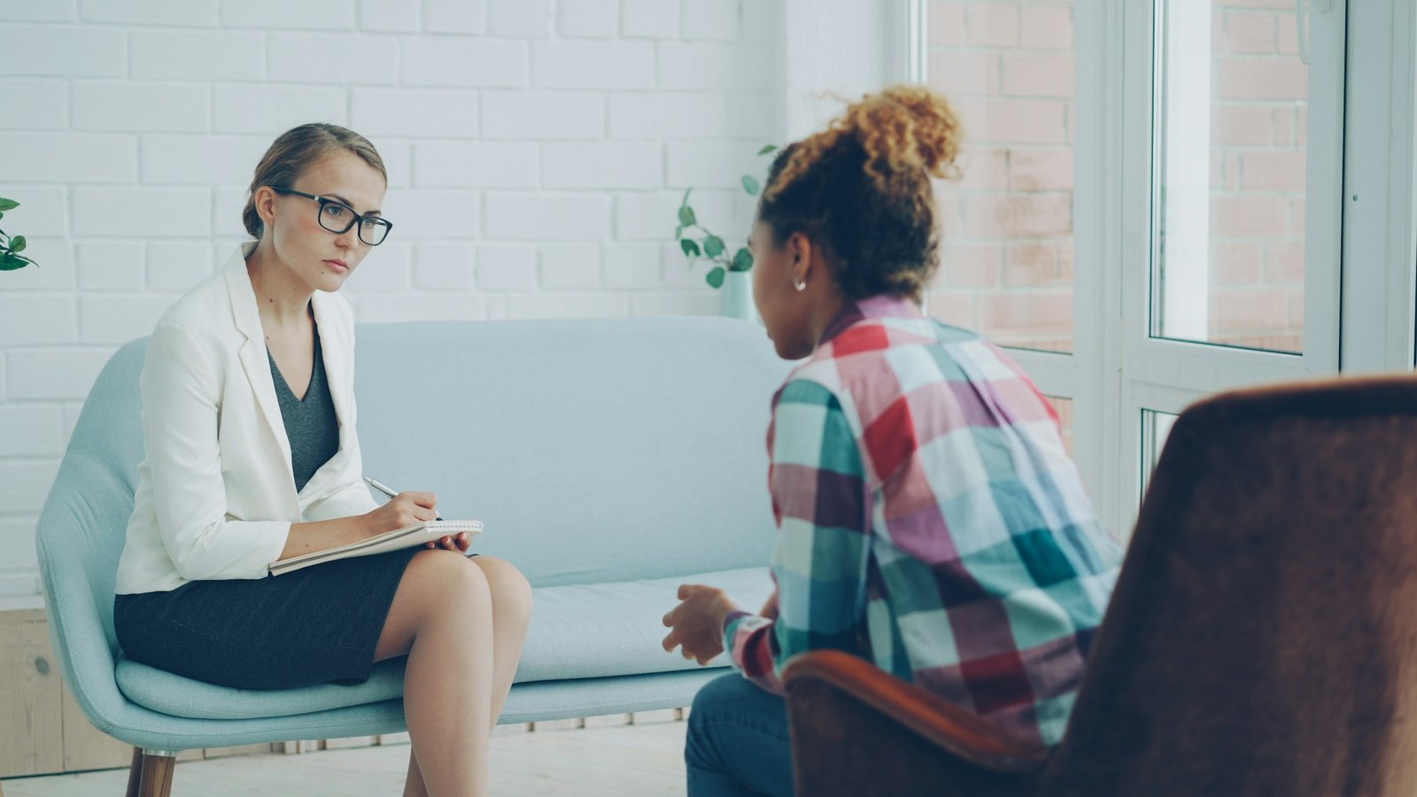 A therapist listening during a supportive counseling conversation